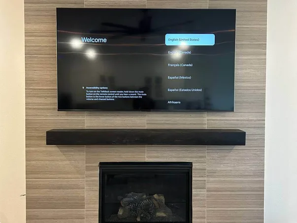 TV above modern fireplace
